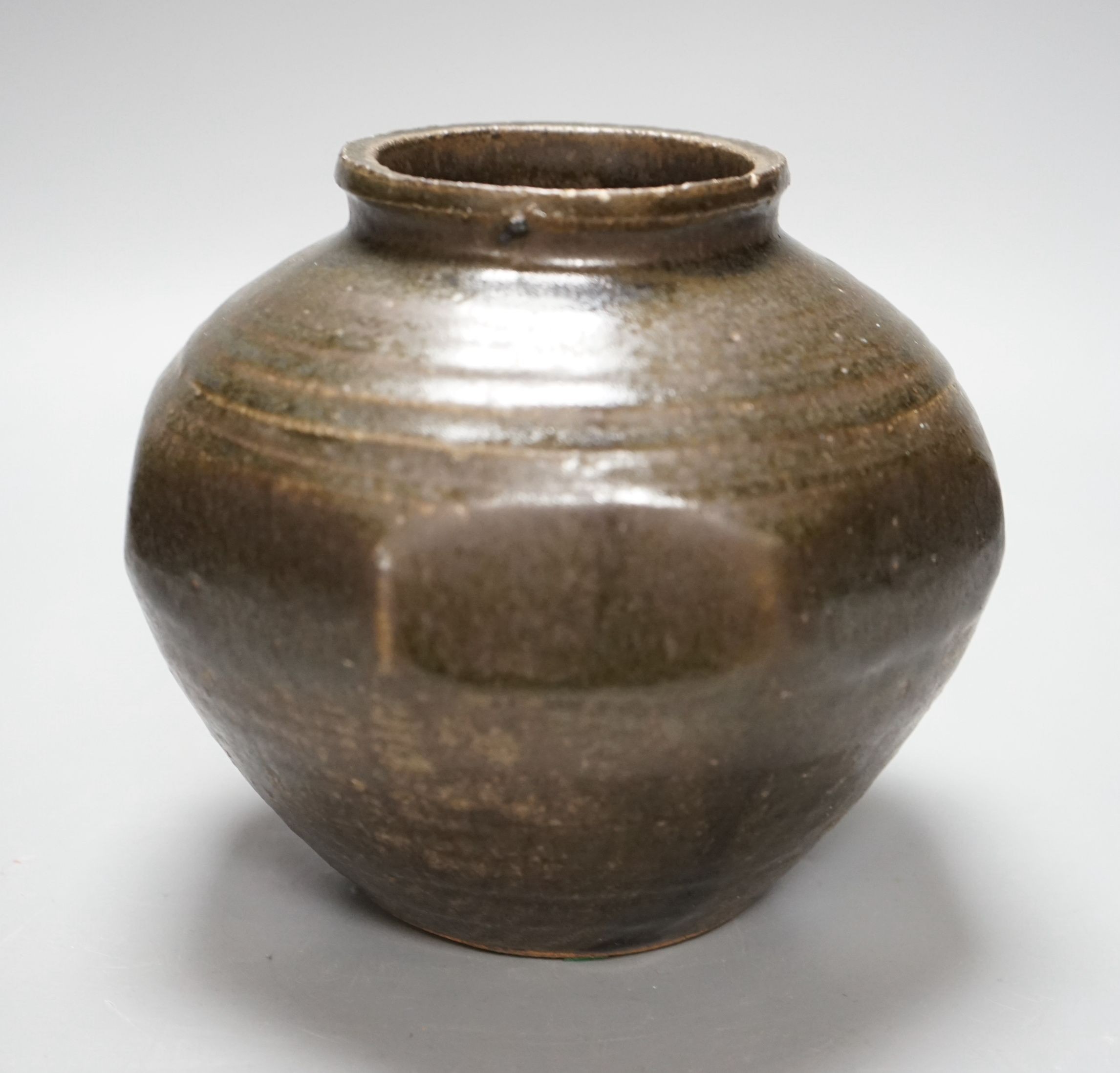 Attributed to Robert Fournier, but possibly by Ray Finch, a tenmoku glazed cut sided ovoid pot, ex Bonhams, 2nd December sale 1989, lot 209, impressed mark to rim, 15cm tall